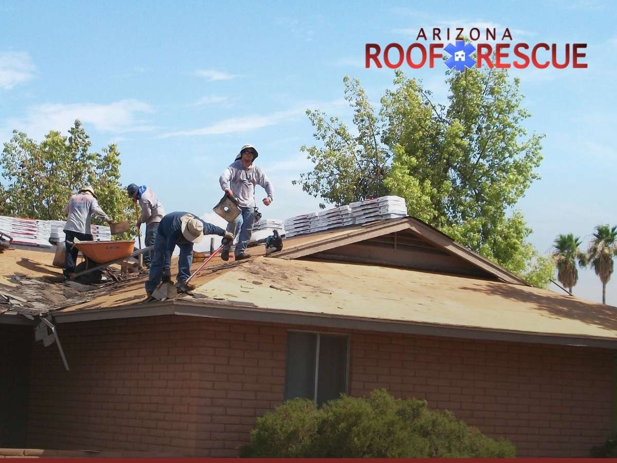 Professional Roofing Contractors Working On A Roof Replacement In Glendale, AZ